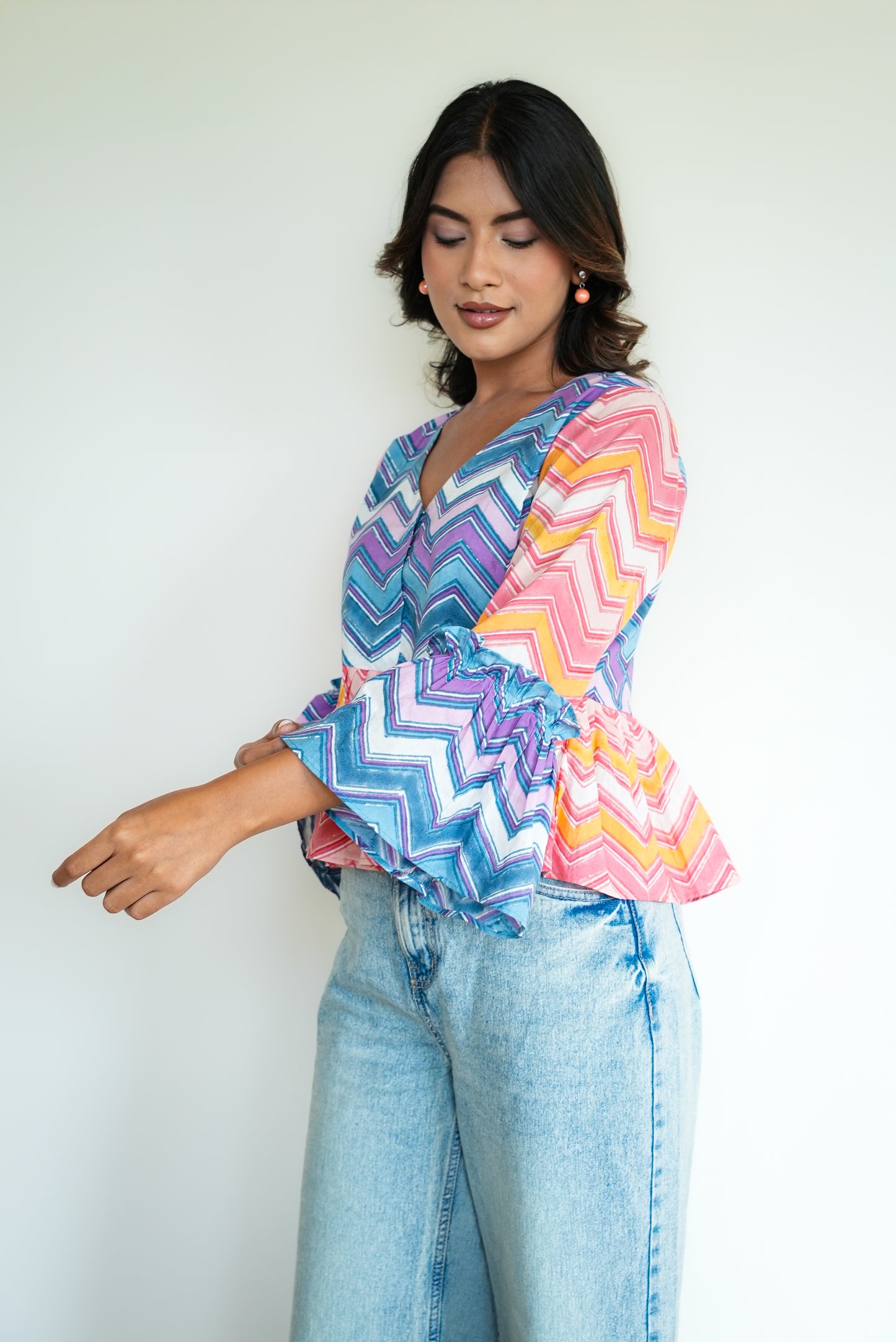 Daisy – Multicolor Chevron Peplum Top