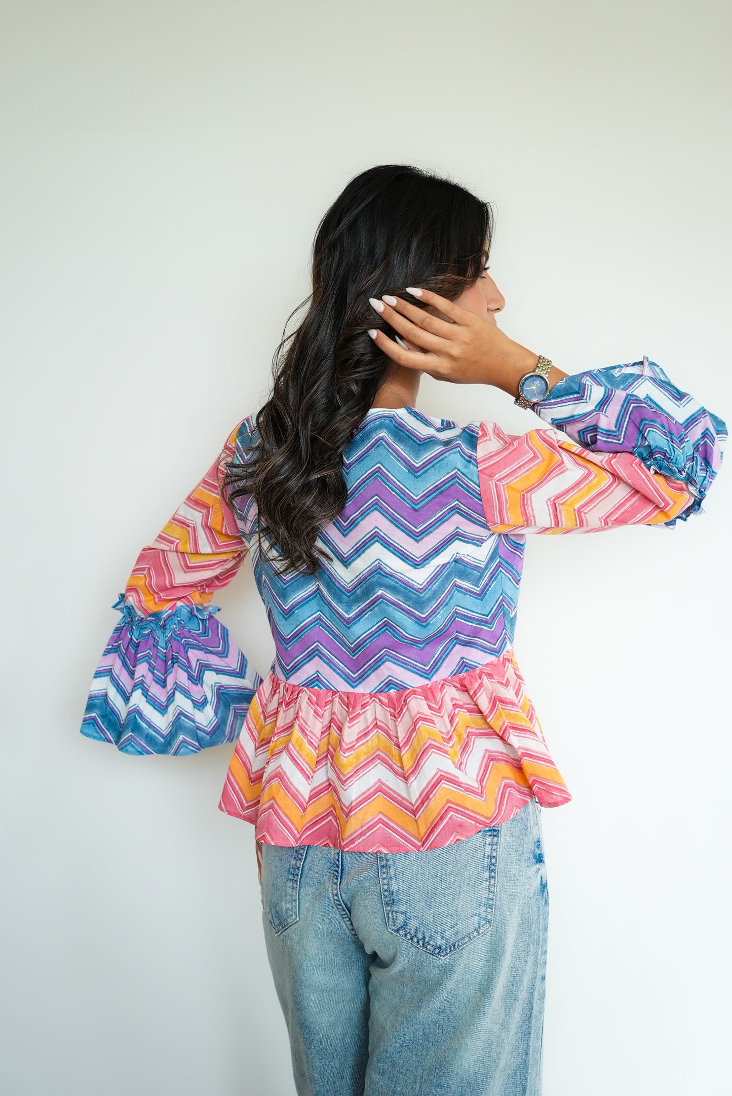 Daisy – Multicolor Chevron Peplum Top